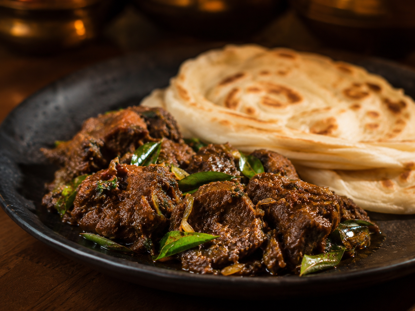 Beef Roast — Kerala-style beef simmered in roasted coconut and black pepper masala.